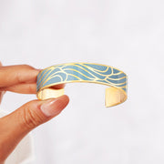 You can't stop the waves but you can learn to move with them Waves Bangle